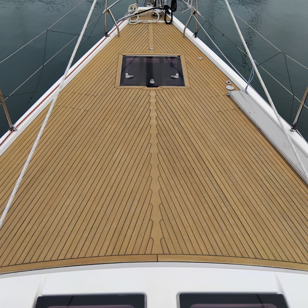 The foredeck of a 60ft yacht made of high quality teak with Semco Natural Teak Sealer applied.