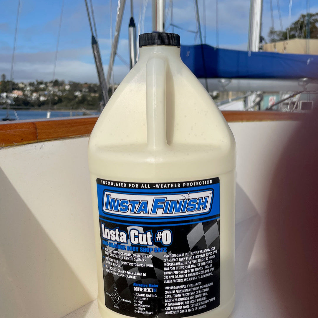 a bottle of insta cut 0 on a yacht with most yachts masts in the background. 