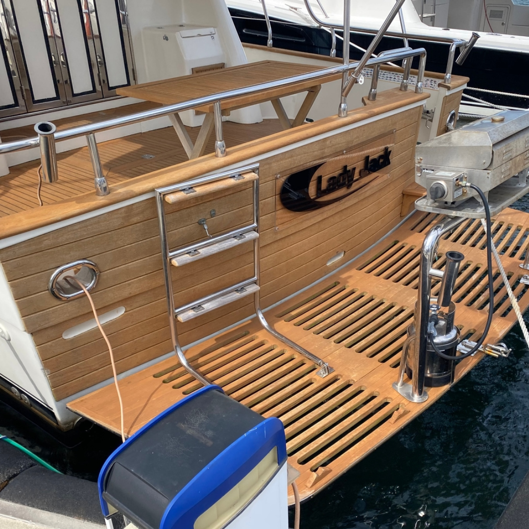 Back deck and swim platform of a large cruiser with Semco Honeytone Teak Sealer applied. 